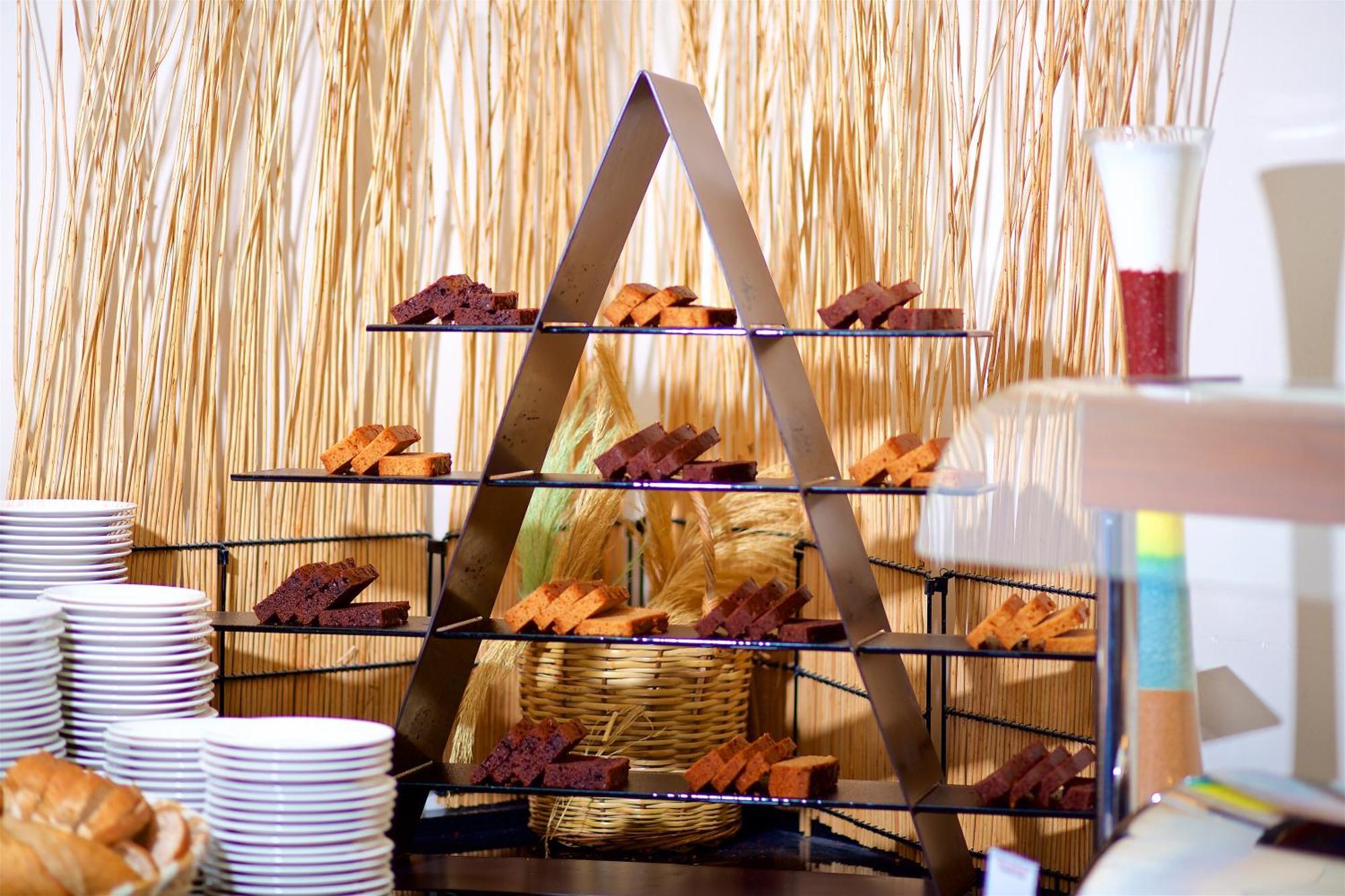Ramada By Wyndham Istanbul Merter Exterior photo A tiered display of desserts